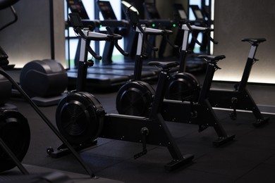 Photo of Many modern professional bicycle machines in gym