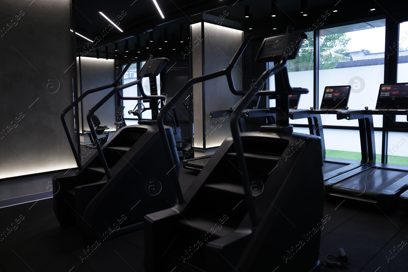 Professional stair climber machines in gym. Healthy lifestyle Photo of Professional stair climber machines in gym. Healthy lifestyle