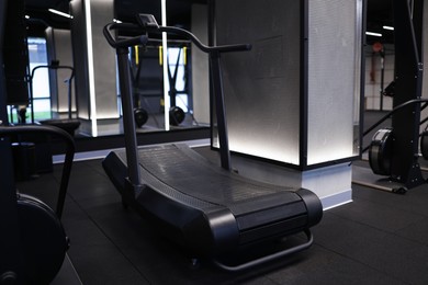 Photo of Modern professional treadmill in gym. Healthy lifestyle