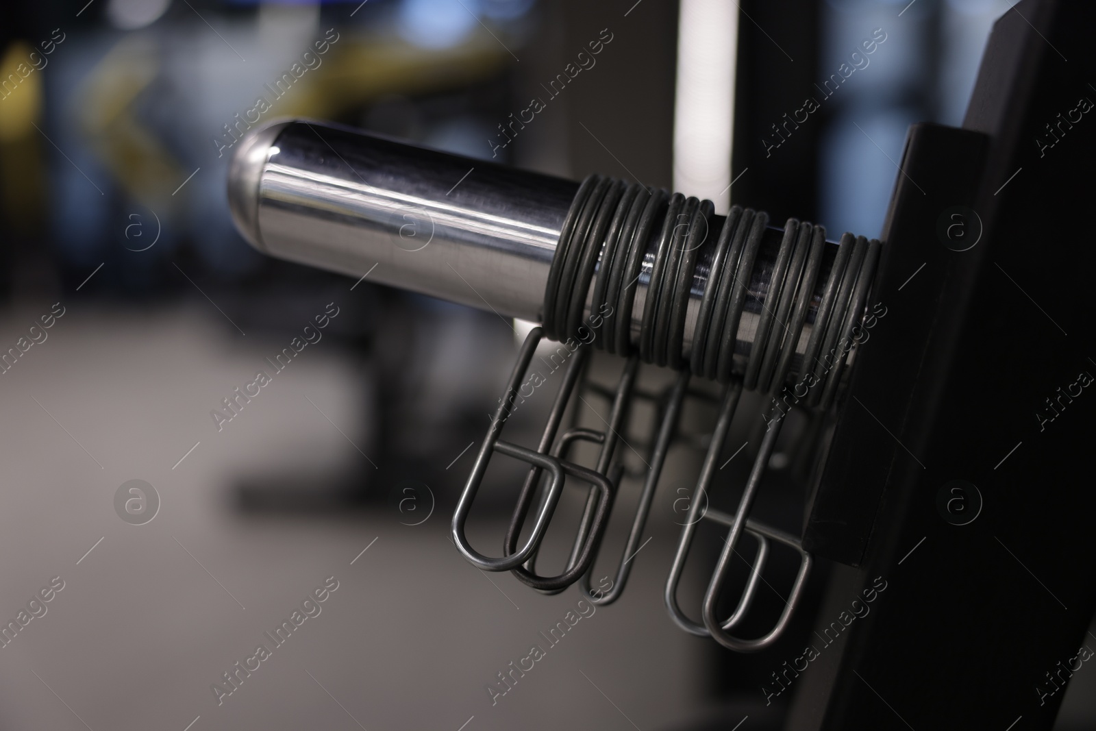 Professional spring collars for barbell in gym, closeup. Healthy lifestyle Photo of Professional spring collars for barbell in gym, closeup. Healthy lifestyle