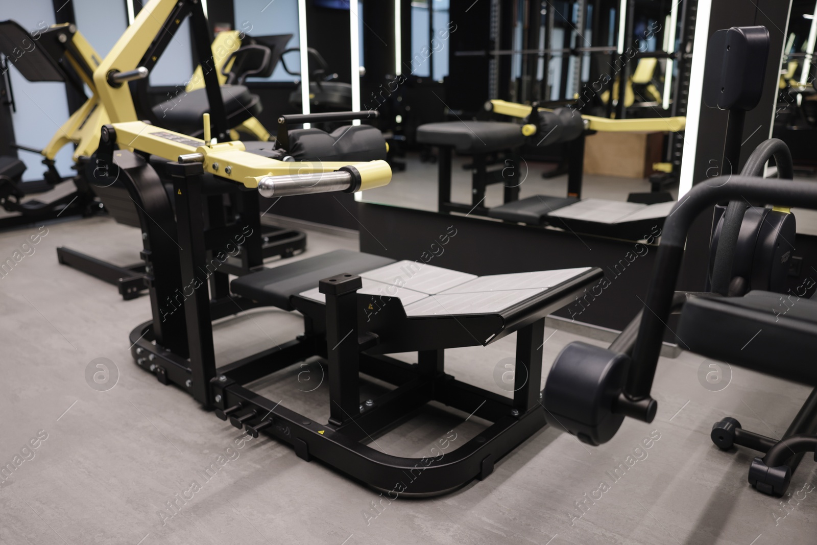 Different exercise equipment in professional gym. Healthy lifestyle Photo of Different exercise equipment in professional gym. Healthy lifestyle