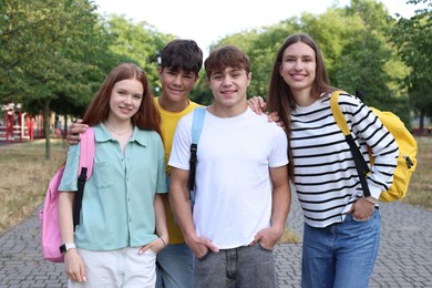 Photo of Group of teenagers spending time together in park