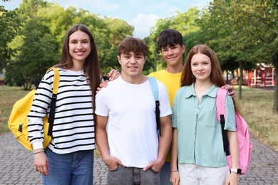 Photo of Group of teenagers spending time together in park