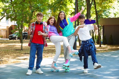 Photo of Group of teenagers spending time together in park