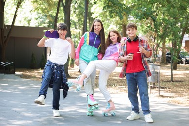 Photo of Group of teenagers spending time together in park