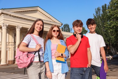 Photo of Group of teenagers walking together on city street