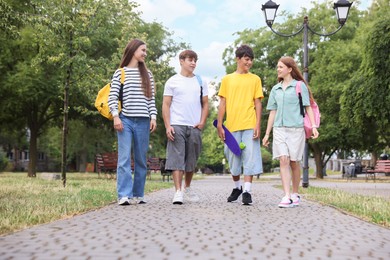 Photo of Group of teenagers spending time together outdoors