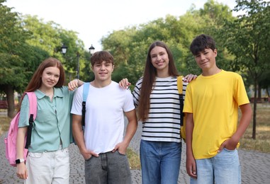 Photo of Group of teenagers spending time together outdoors