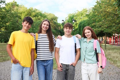 Photo of Group of teenagers spending time together outdoors