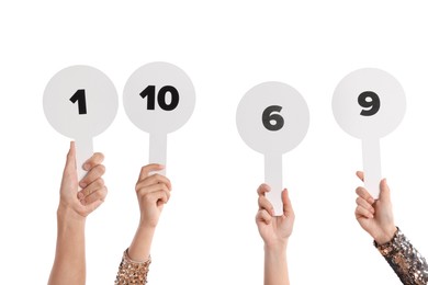 Photo of Panel of judges voting with score signs on white background, closeup
