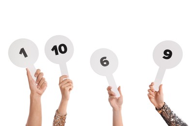 Photo of Panel of judges voting with score signs on white background, closeup