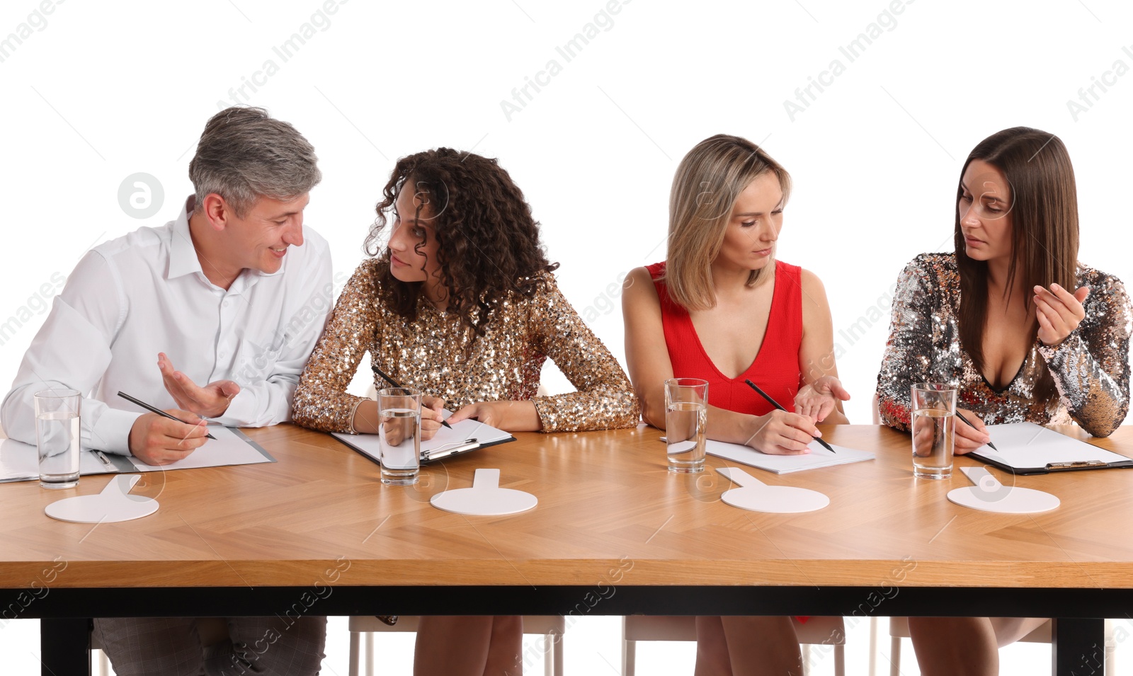 Panel of judges consulting at table on white background Photo of Panel of judges consulting at table on white background