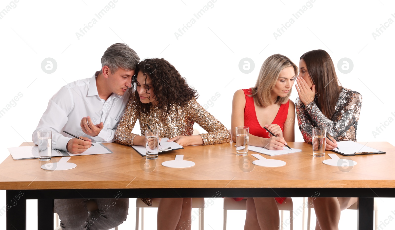 Panel of judges consulting at table on white background Photo of Panel of judges consulting at table on white background
