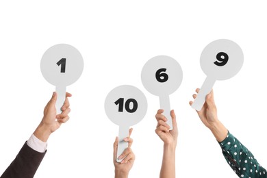Photo of Panel of judges voting with score signs on white background, closeup