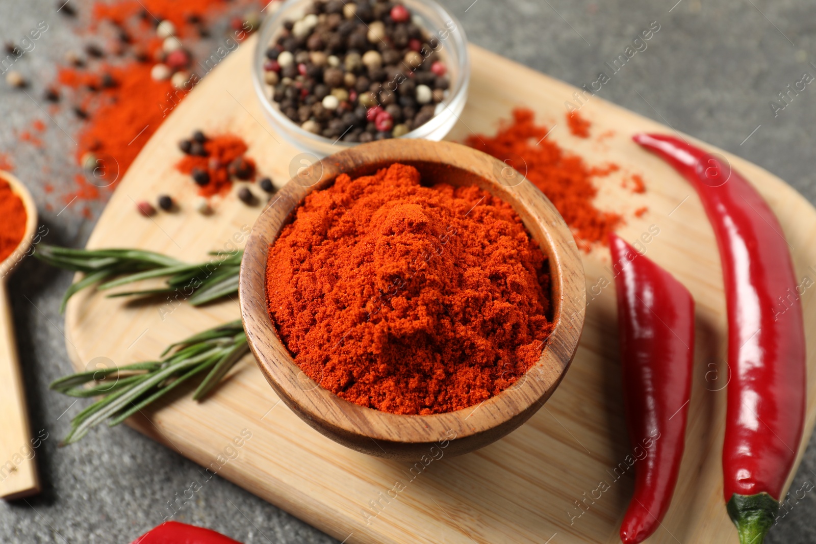 Different aromatic spices on grey wooden table, above view Photo of Different aromatic spices on grey wooden table, above view