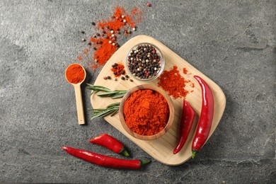 Photo of Different aromatic spices on grey table, flat lay