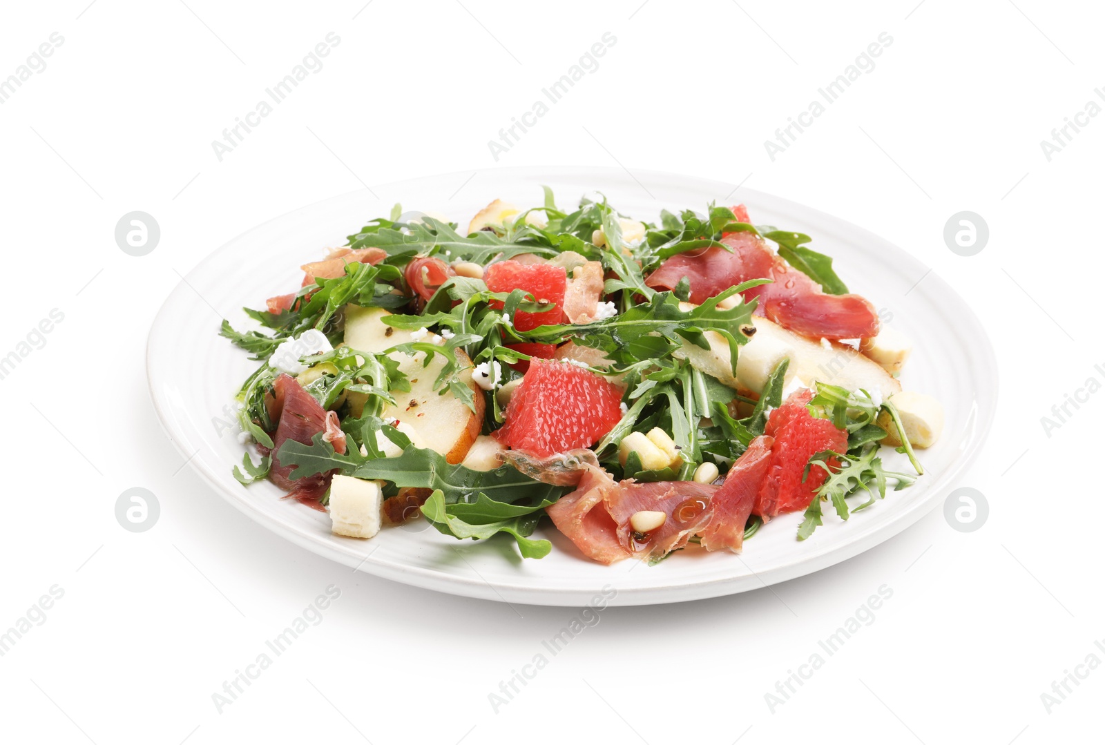 Photo of Tasty salad with arugula, prosciutto, cheese, pear, grapefruit and nuts isolated on white
