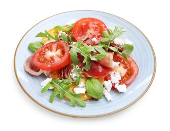 Photo of Tasty salad with arugula, cheese, tomatoes, nuts and prosciutto isolated on white