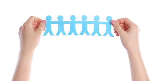 Photo of Woman holding paper figures of people on white background, closeup