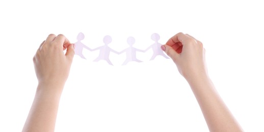 Photo of Woman holding paper figures of people on white background, closeup