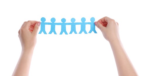 Photo of Woman holding paper figures of people on white background, closeup