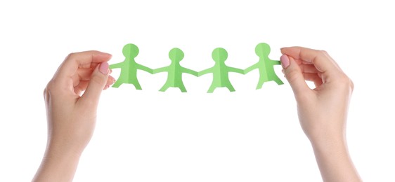 Photo of Woman holding paper figures of people on white background, closeup