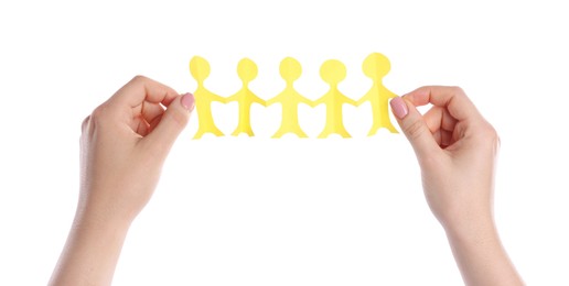 Photo of Woman holding paper figures of people on white background, closeup