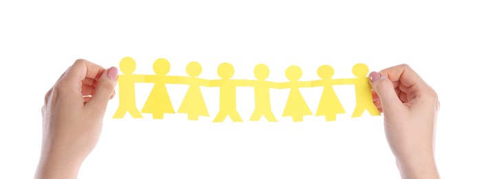 Photo of Woman holding paper figures of people on white background, closeup