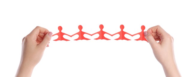 Photo of Woman holding paper figures of people on white background, closeup