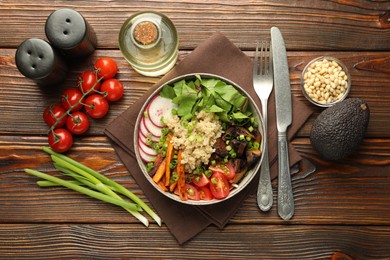 Photo of Healthy vegetarian food. Delicious Buddha bowl and ingredients on wooden table, flat lay