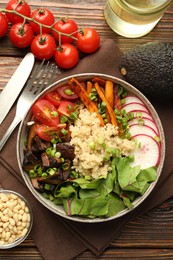 Photo of Healthy vegetarian food. Delicious Buddha bowl and ingredients on wooden table, flat lay