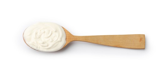 Photo of Delicious sour cream in spoon isolated on white, top view