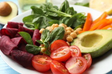 Photo of Different healthy vegetarian food on table, closeup