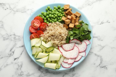 Photo of Different healthy vegetarian food on white marble table, top view