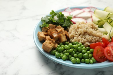 Photo of Different healthy vegetarian food on white marble table, closeup. Space for text