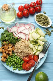 Photo of Different healthy vegetarian food served on light blue wooden table, flat lay