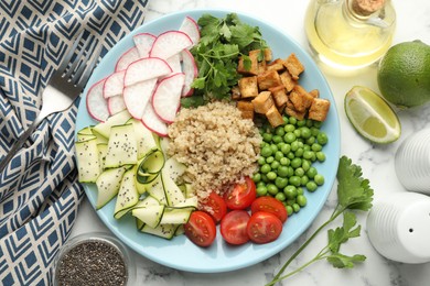 Photo of Different healthy vegetarian food served on white marble table, flat lay