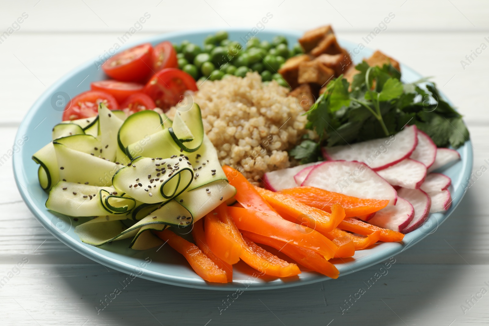 Different healthy vegetarian food on white wooden table, closeup Photo of Different healthy vegetarian food on white wooden table, closeup