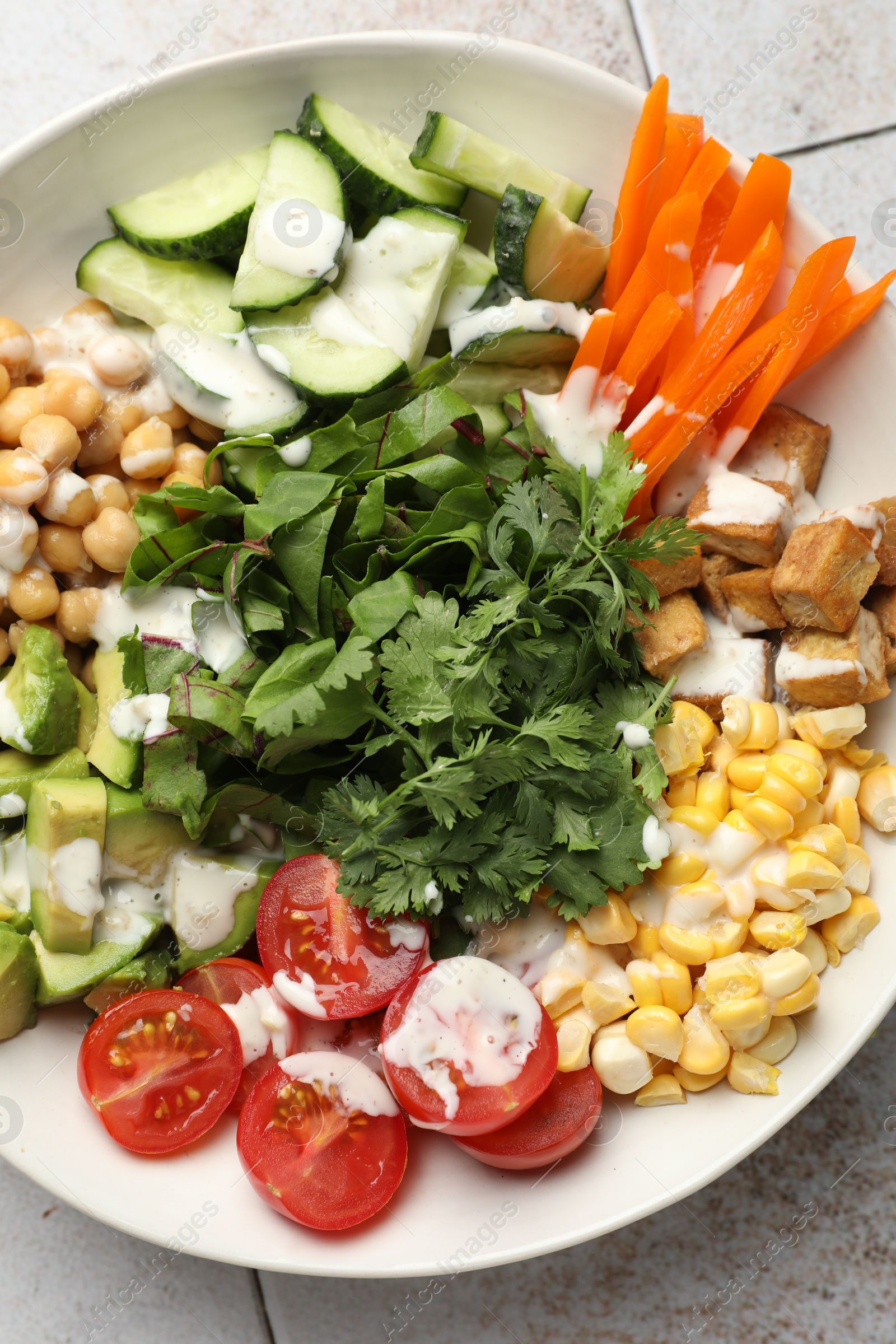 Photo of Different healthy vegetarian food on light table, top view