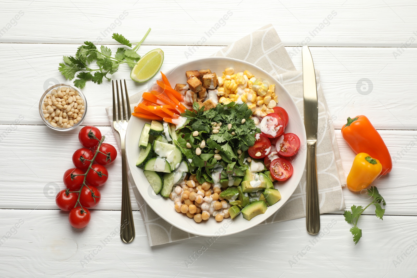 Different healthy vegetarian food served on white wooden table, flat lay Photo of Different healthy vegetarian food served on white wooden table, flat lay