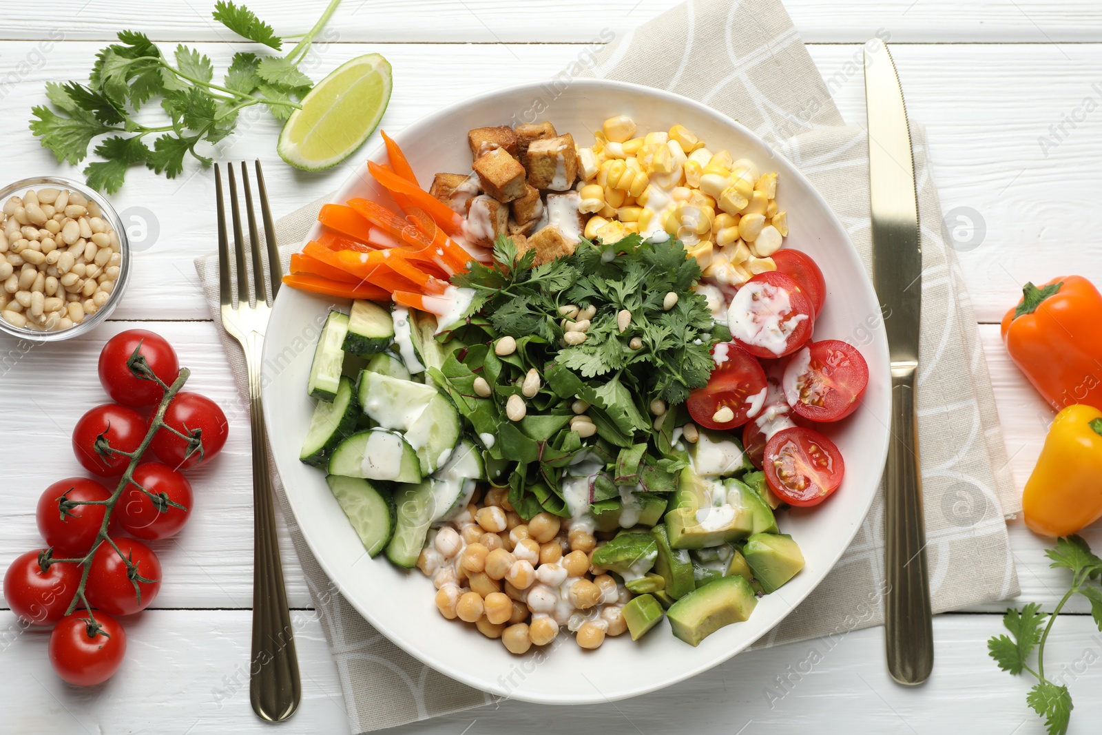 Different healthy vegetarian food served on white wooden table, flat lay Photo of Different healthy vegetarian food served on white wooden table, flat lay