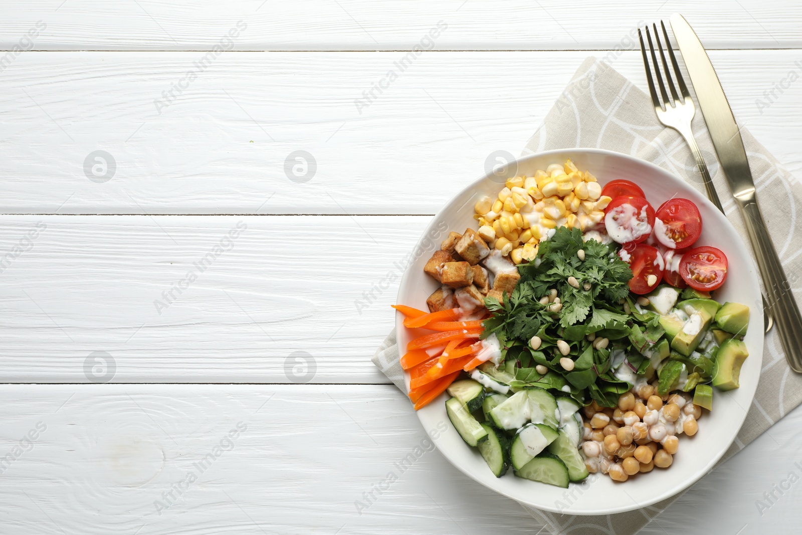 Different healthy vegetarian food served on white wooden table, flat lay. Space for text Photo of Different healthy vegetarian food served on white wooden table, flat lay. Space for text