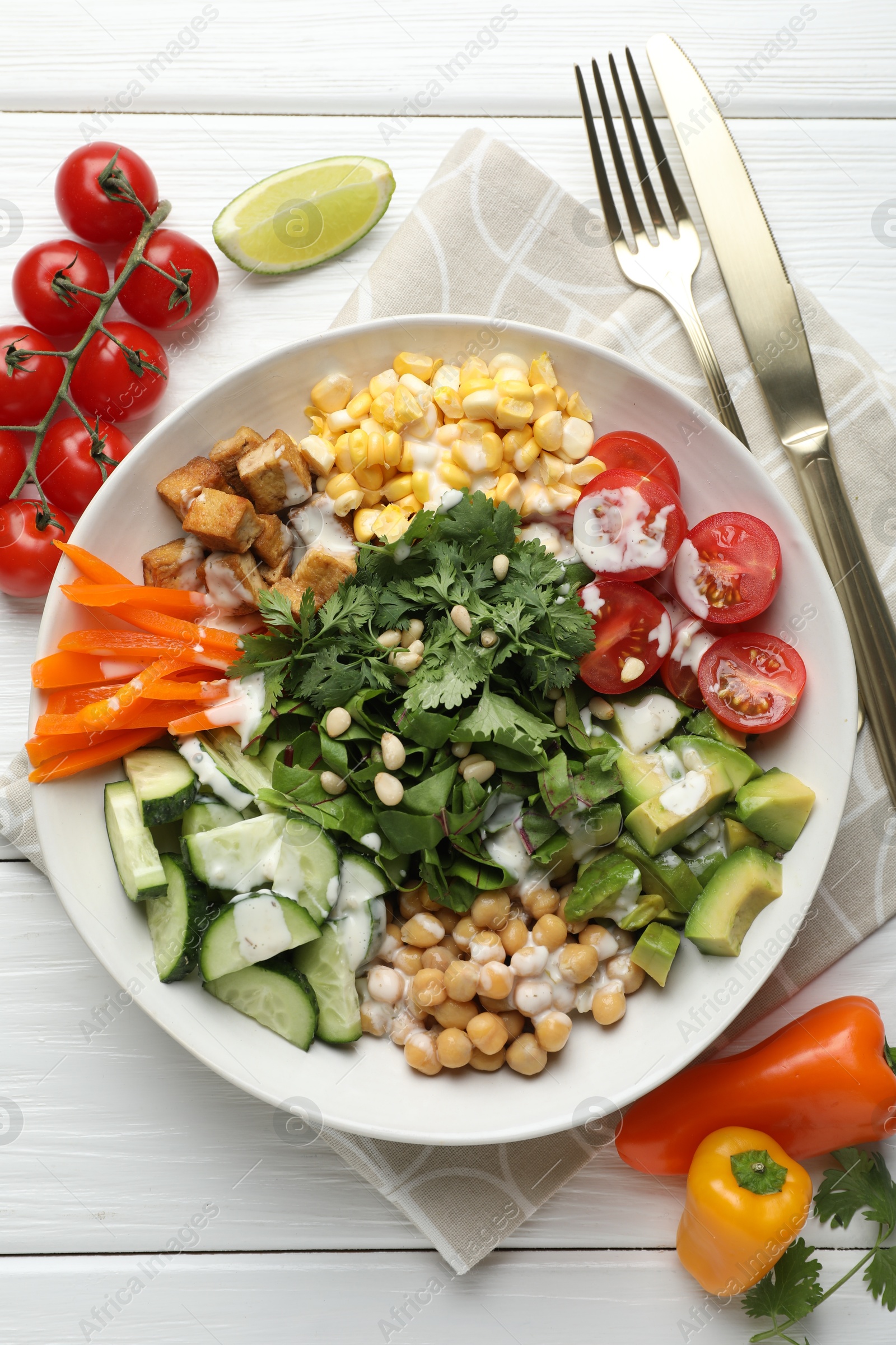 Different healthy vegetarian food served on white wooden table, flat lay Photo of Different healthy vegetarian food served on white wooden table, flat lay