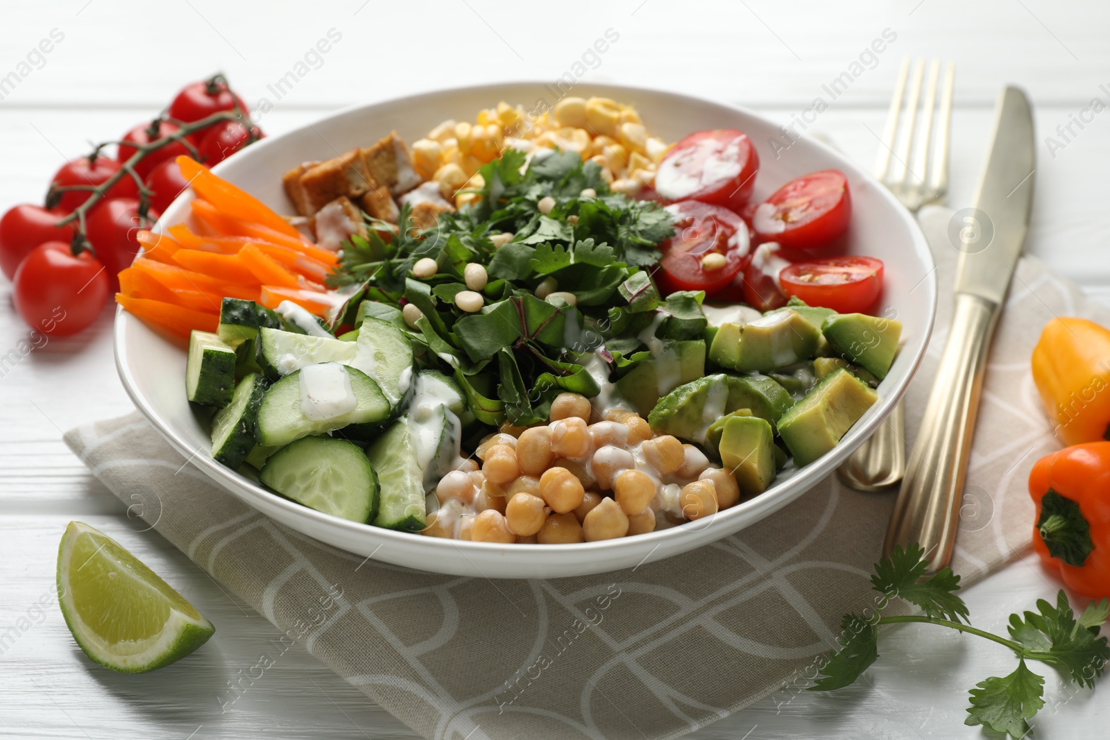 Different healthy vegetarian food served on white wooden table, closeup Photo of Different healthy vegetarian food served on white wooden table, closeup