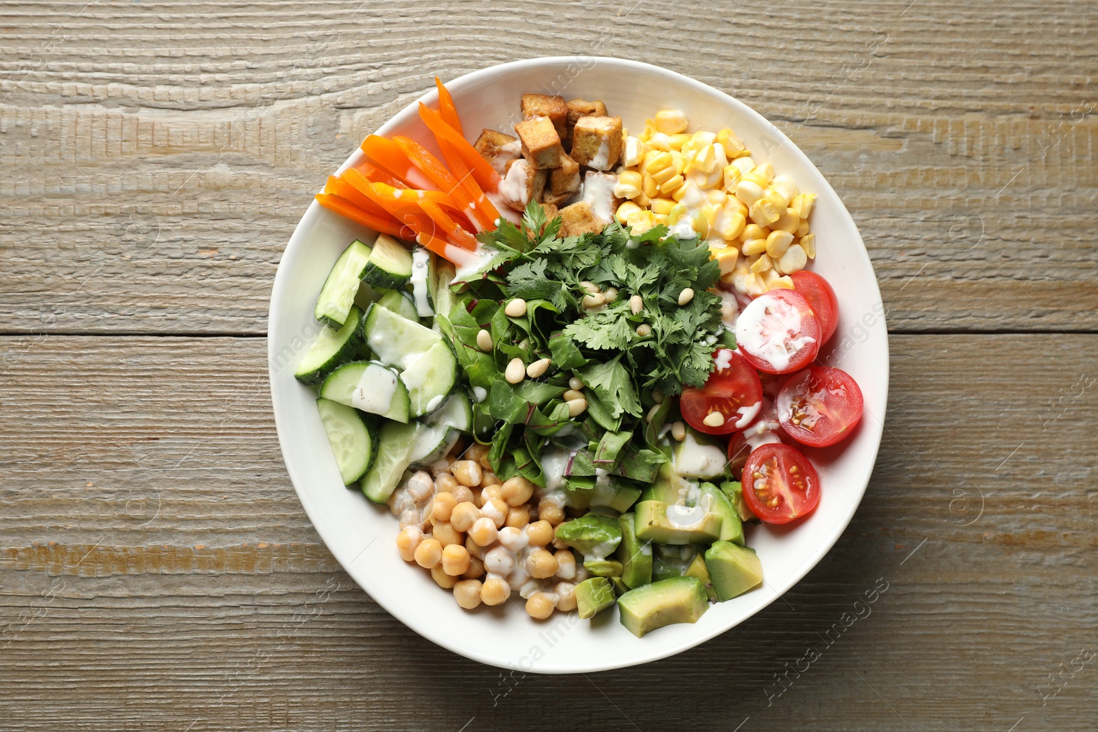 Different healthy vegetarian food on wooden table, top view Photo of Different healthy vegetarian food on wooden table, top view