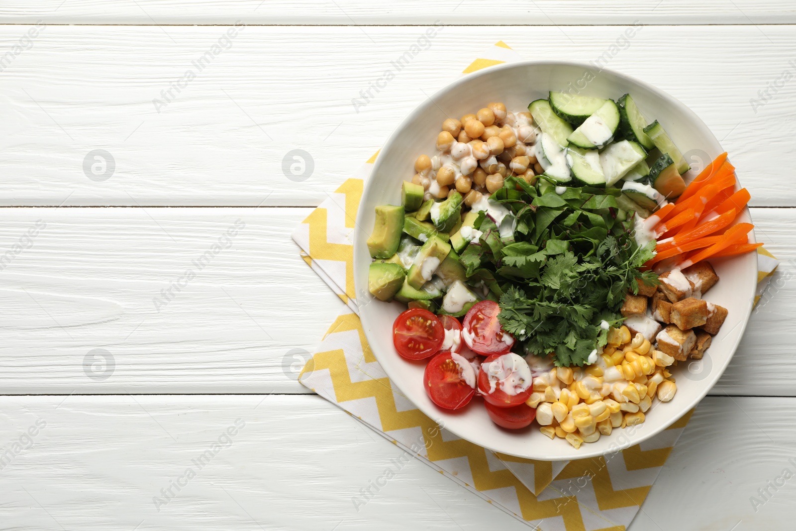 Different healthy vegetarian food on white wooden table, top view. Space for text Photo of Different healthy vegetarian food on white wooden table, top view. Space for text