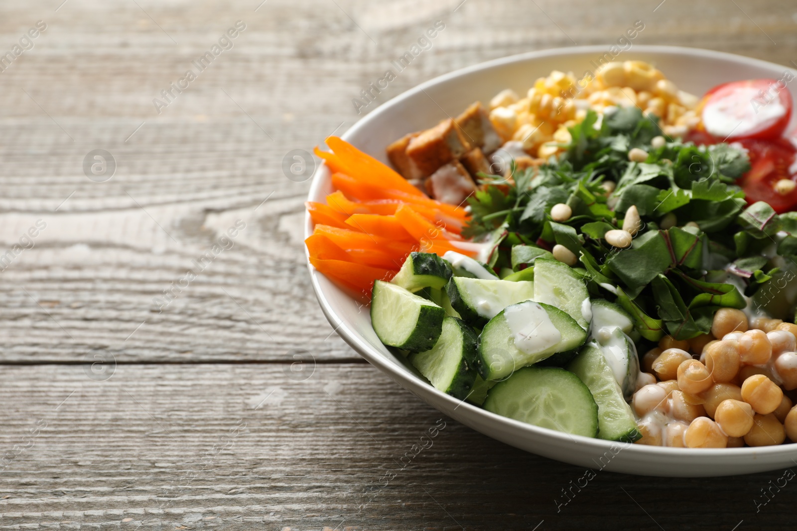 Different healthy vegetarian food on wooden table, closeup. Space for text Photo of Different healthy vegetarian food on wooden table, closeup. Space for text