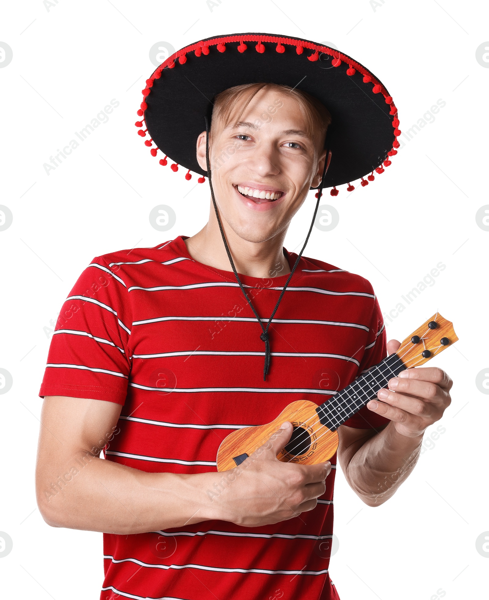 Smiling man in black Flamenco hat playing ukulele on white background Photo of Smiling man in black Flamenco hat playing ukulele on white background