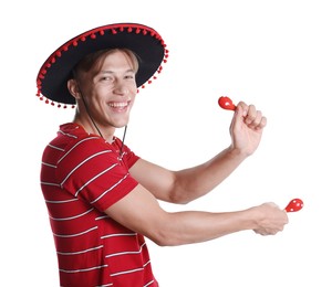 Photo of Happy man in black Flamenco hat playing maracas on white background