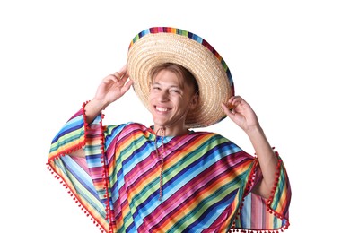 Photo of Portrait of smiling man in sombrero hat and colorful poncho on white background